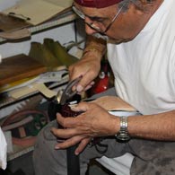 carmelo working on a handmade golf shoe