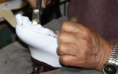 custom golf shoe being created by hand